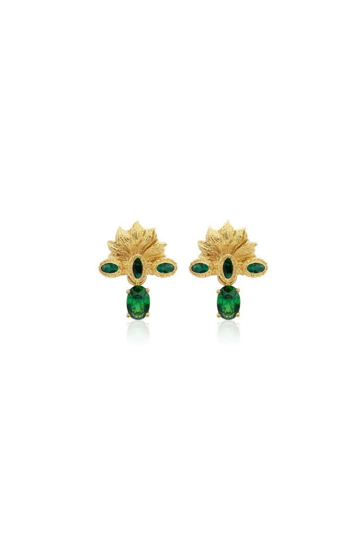 Gold earrings with green gemstones on a white background