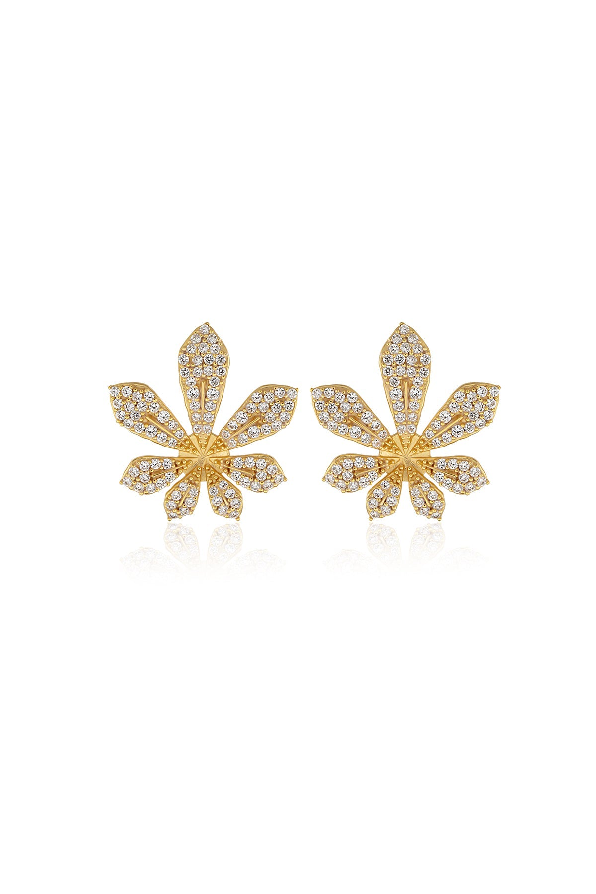 A pair of gold-colored floral design earrings adorned with purple Swarovski crystals.