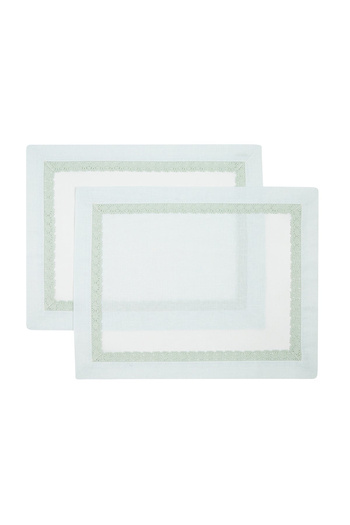 Two rectangular white linen placemats with a solid pattern.