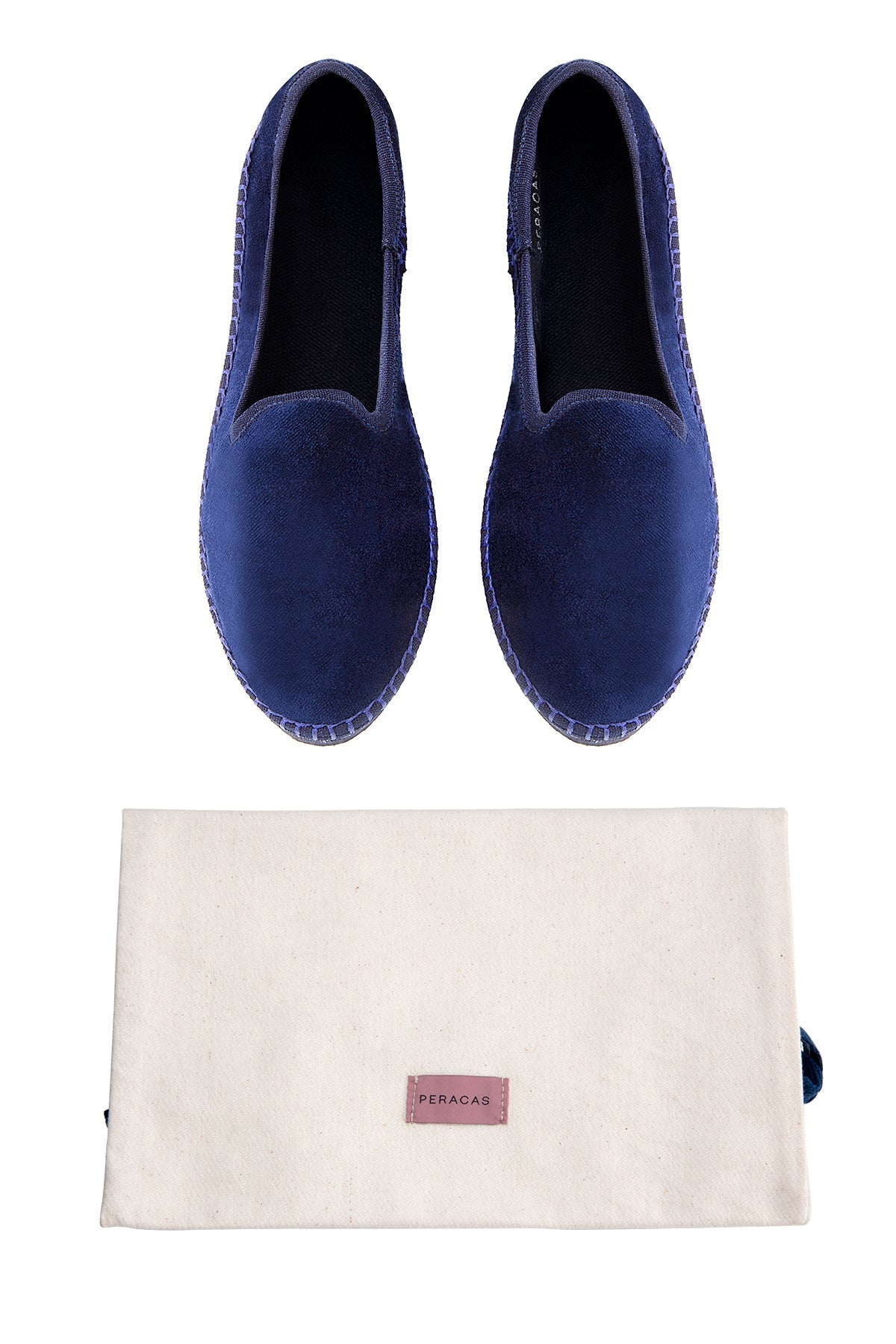 Pair of blue loafers with a white pouch featuring a brand logo on a white background