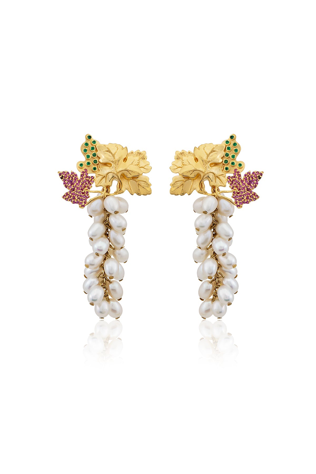 A pair of gold-plated earrings featuring baroque pearls, swarovski crystals, and floral accents.