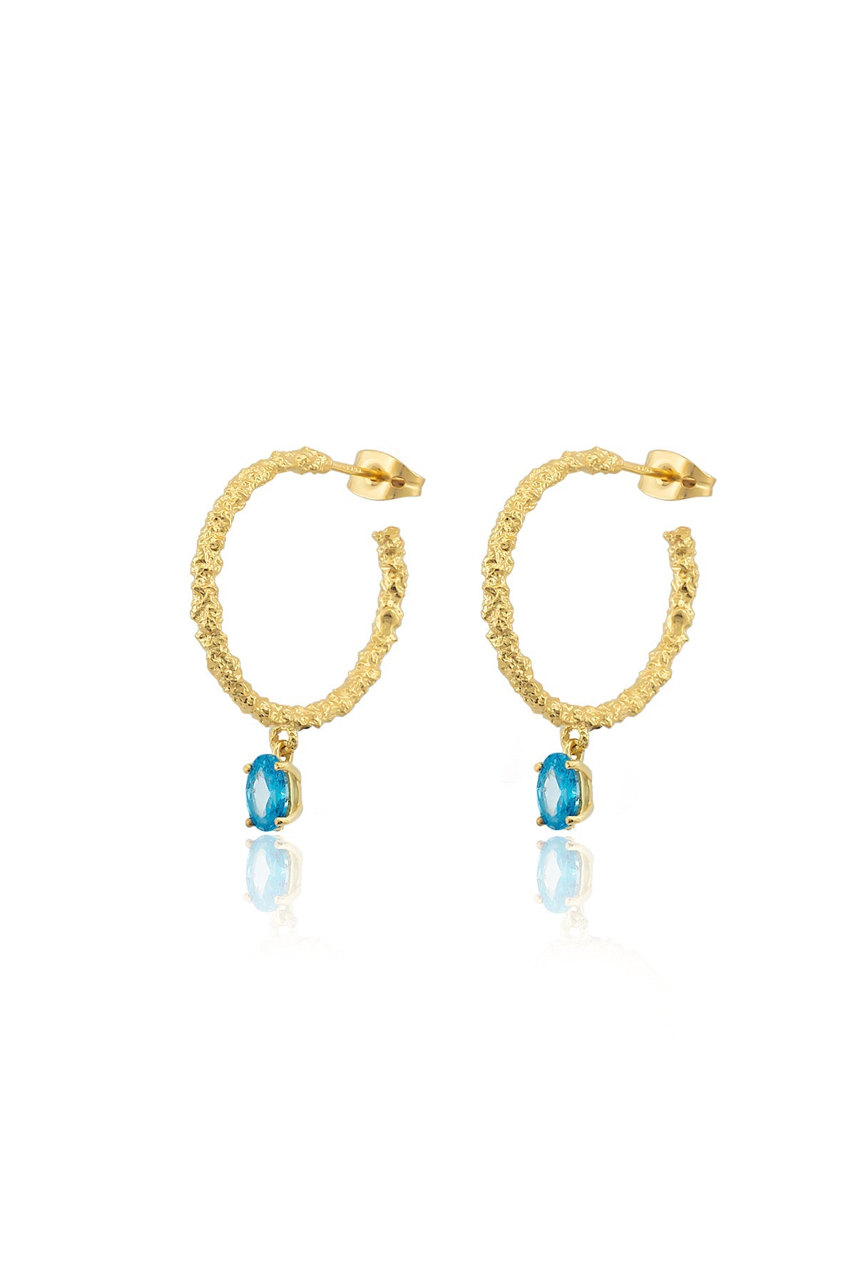 A pair of gold-colored hoop earrings with blue stones attached to the bottom, closed with a pin clasp.