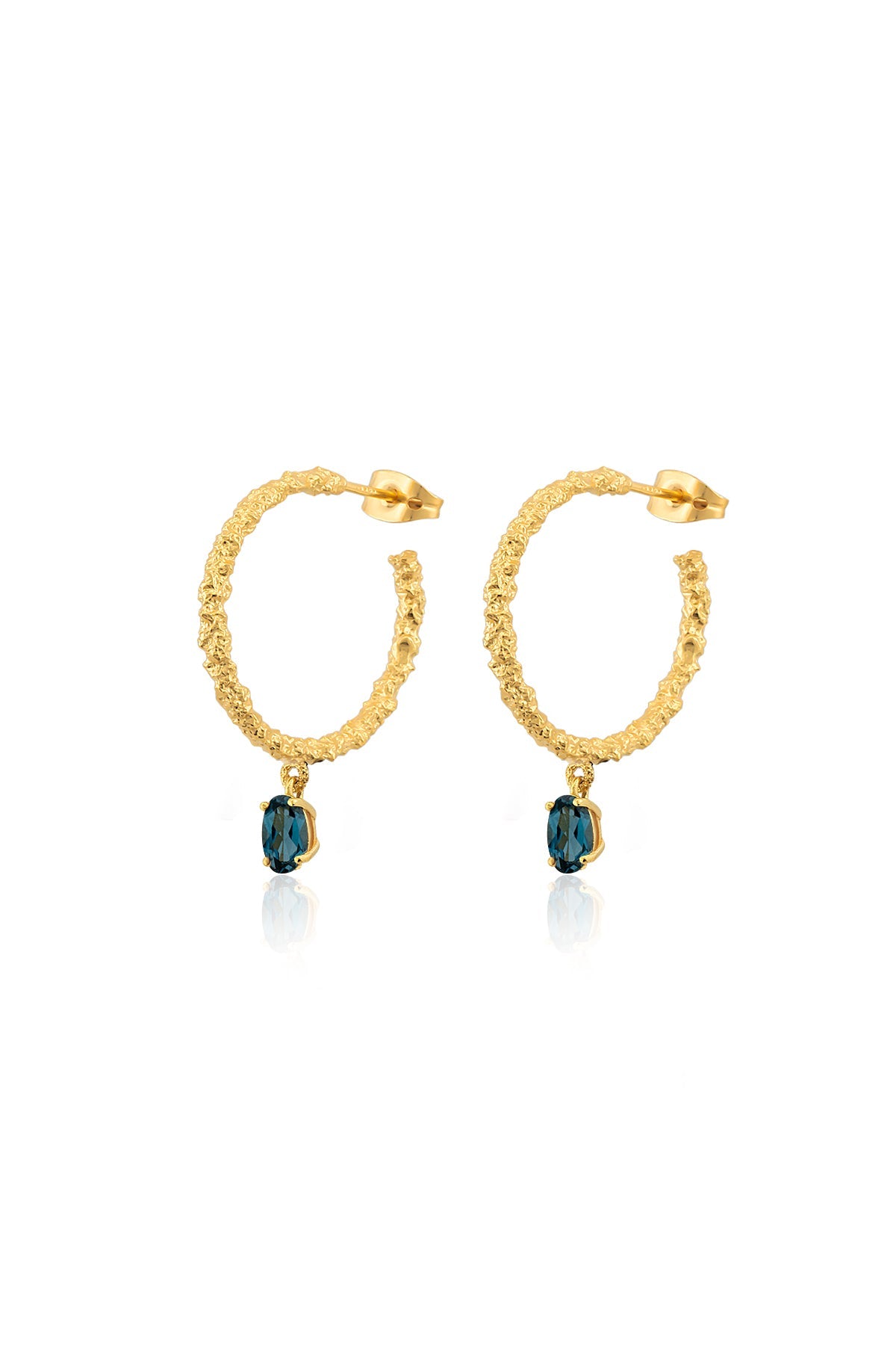A pair of gold-colored hoop earrings with blue stones attached to the bottom, closed with a pin clasp.
