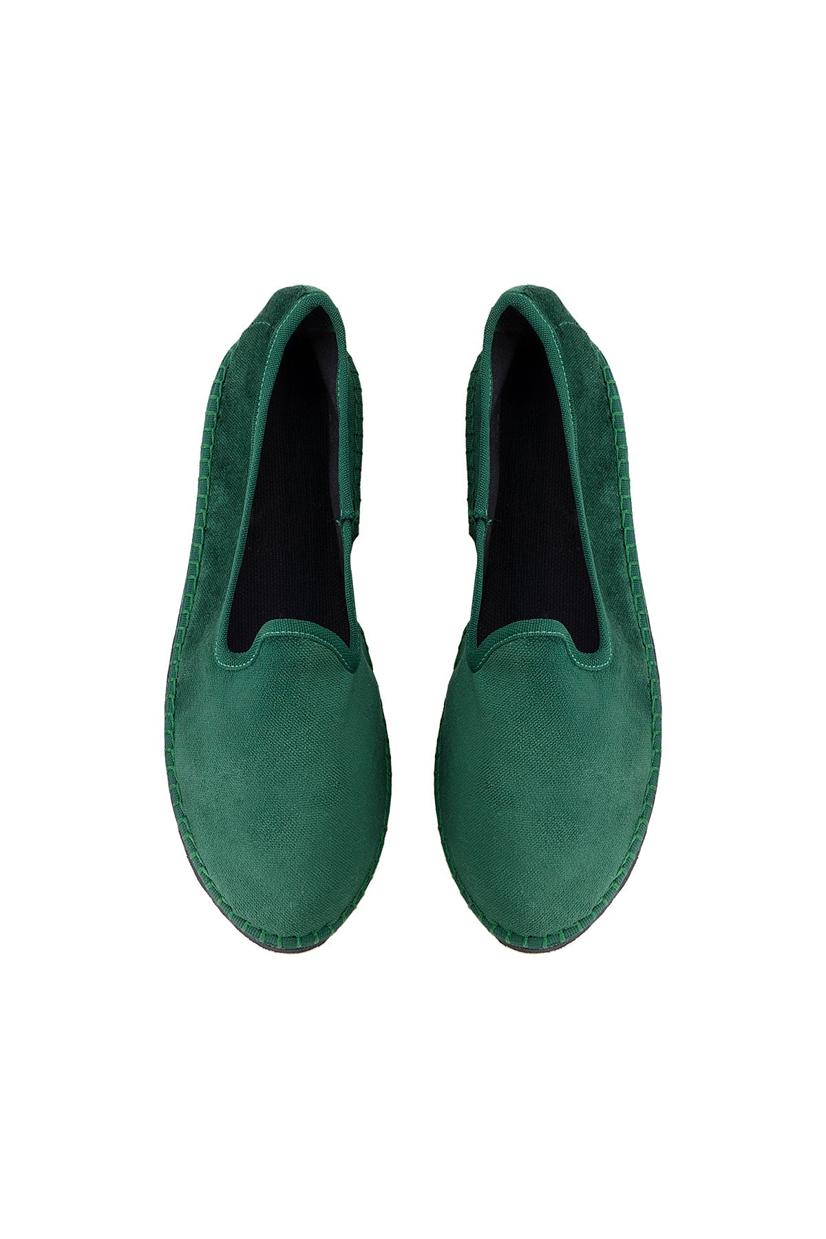 Pair of green loafers on a white background