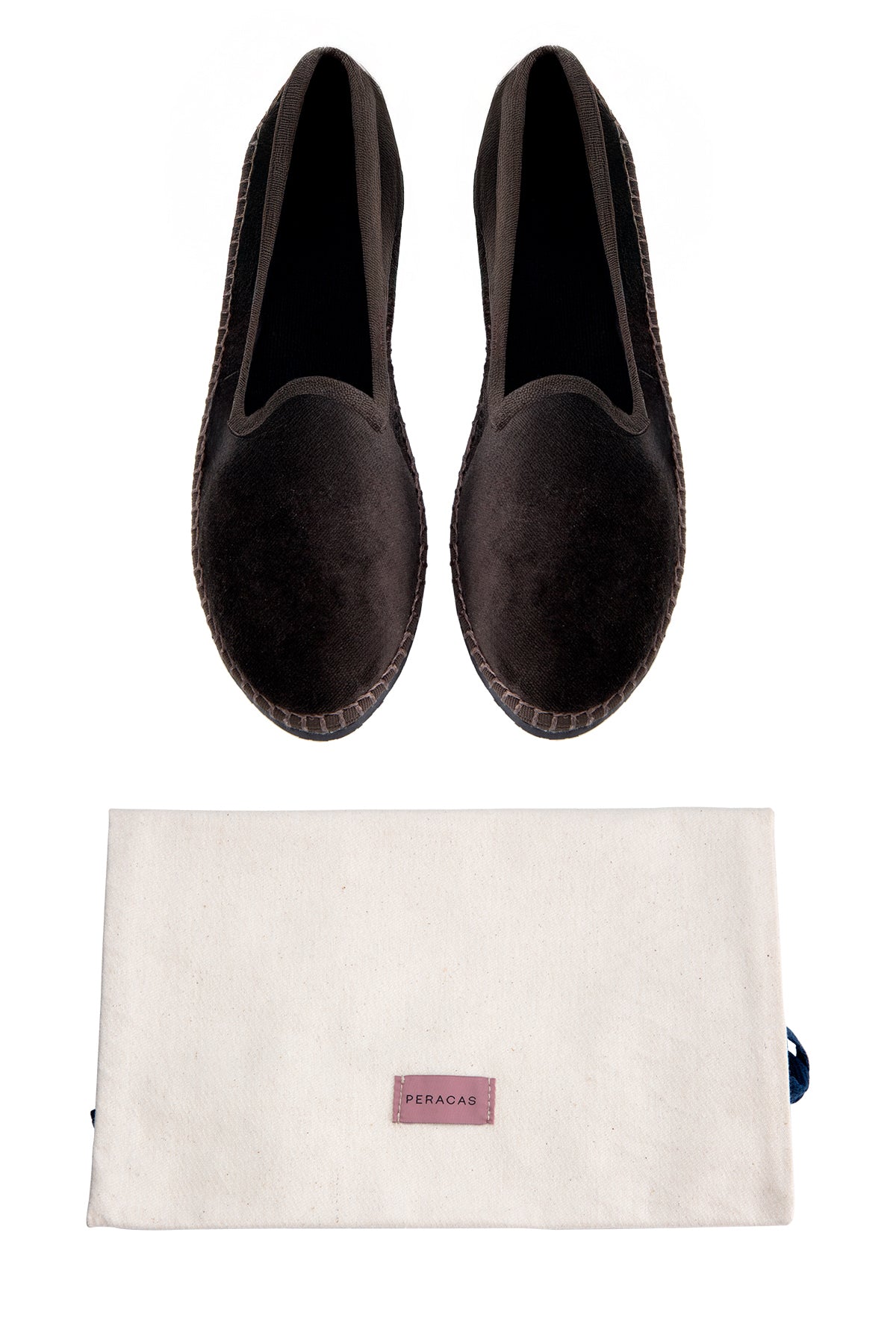 Pair of black loafers with a beige pouch featuring a brand logo on a white background
