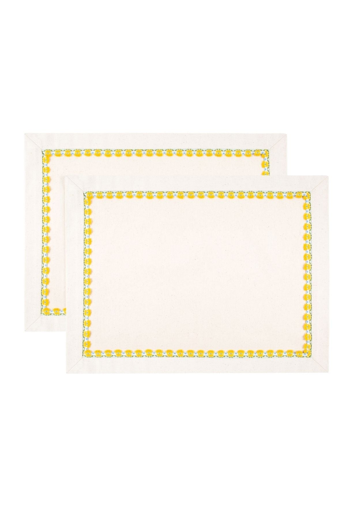 Two white placemats with yellow border designs on a white background
